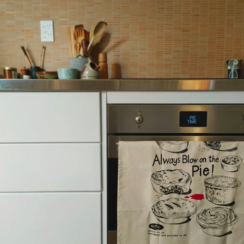 Natty Tea Towel - Always Blow on the Pie