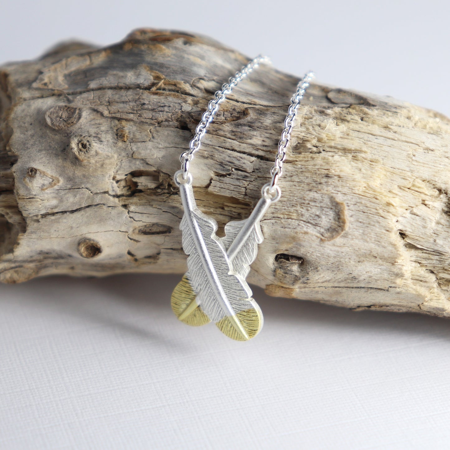 Little Taonga - Crossed Huia Feather Necklace (Silver)